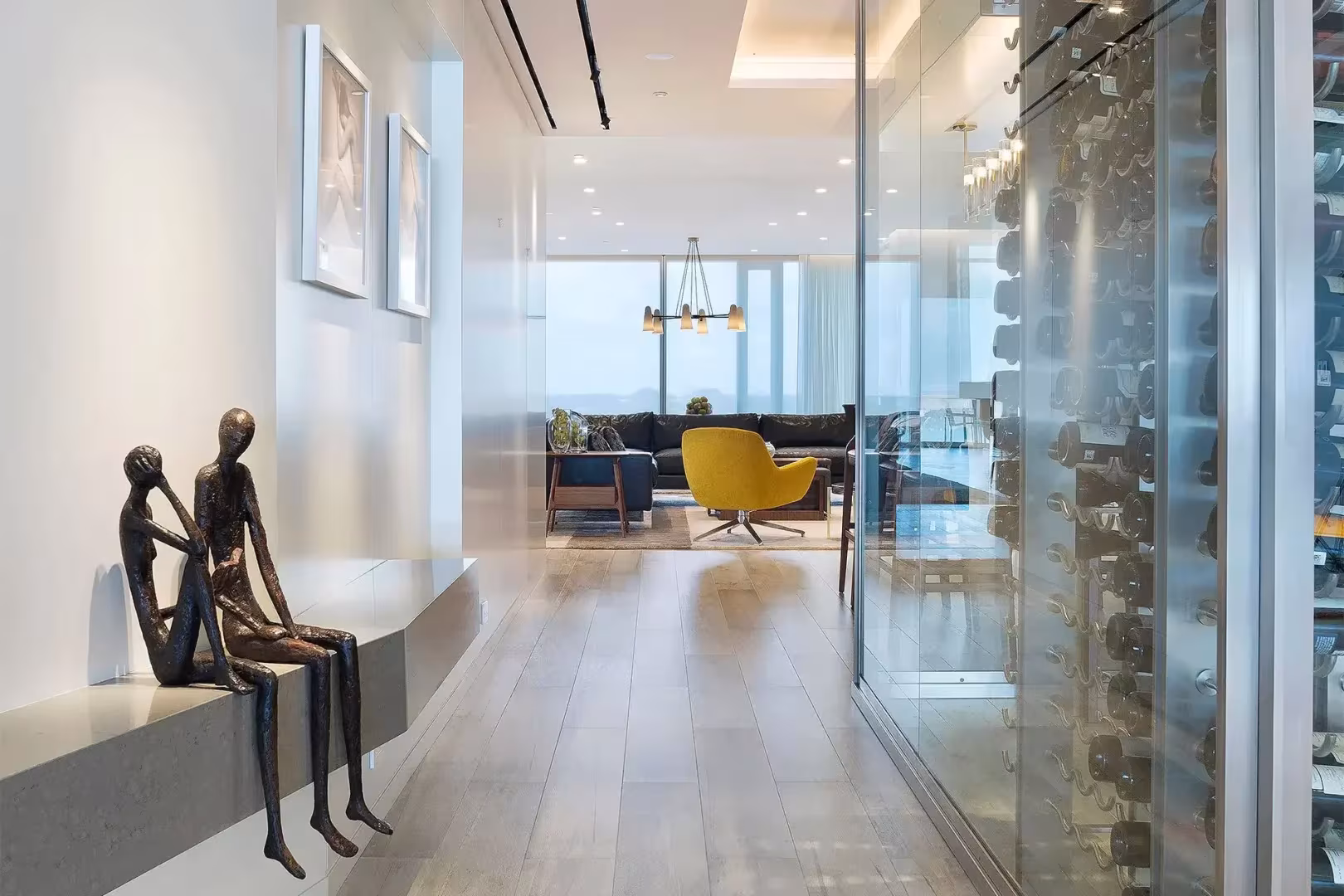 Interior of ODP's Surfside residence, with a glazed wine room and a light-filled living space